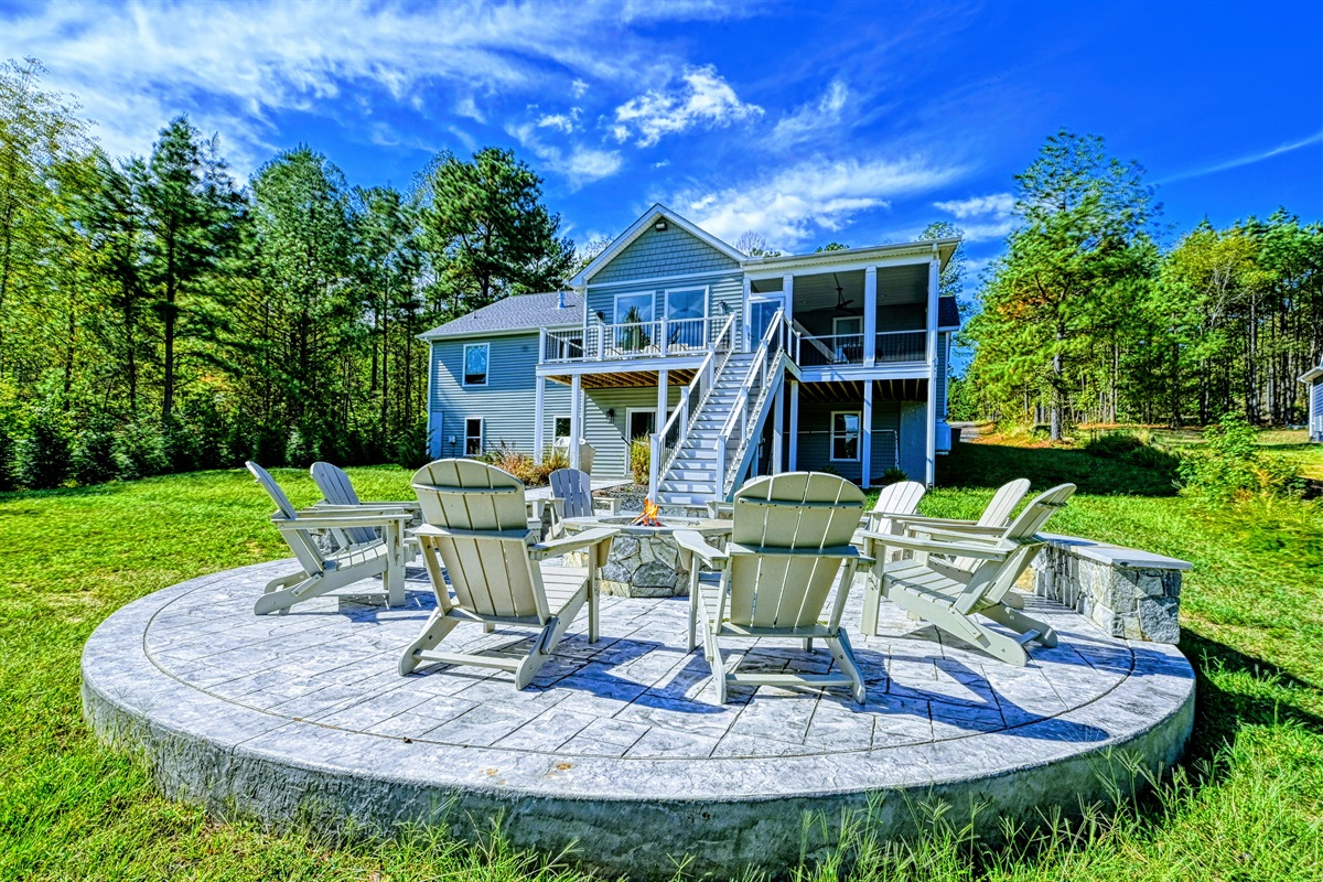 The ultimate gathering spot! Relax by the fire pit with Adirondack seating, surrounded by serene nature and a beautiful lake house. Perfect for cozy nights, s’mores, and unforgettable memories