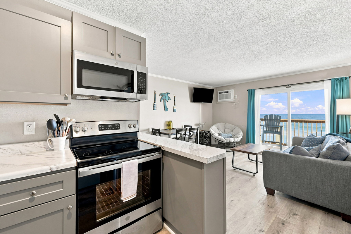 Enjoy the convenience of a coastal kitchen paired with inviting living spaces and the beauty of Topsail Island right outside your door