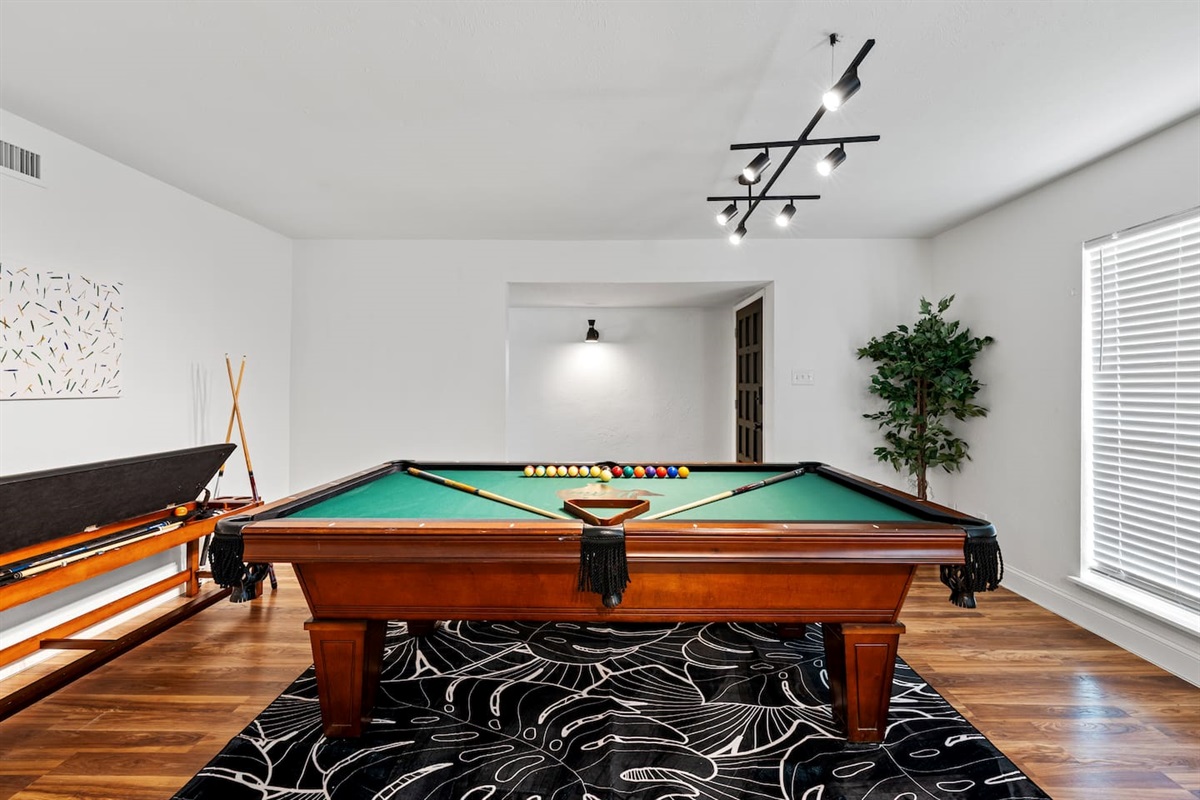Massive game room with plenty of space for pool, seating, and game night memories.