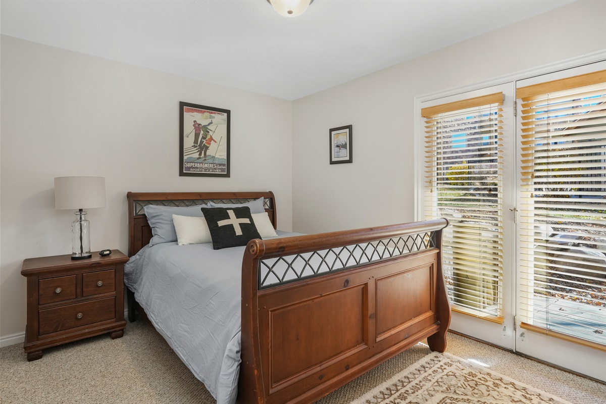 Main-level bedroom with a queen bed—comfortable, convenient, and easy to access.