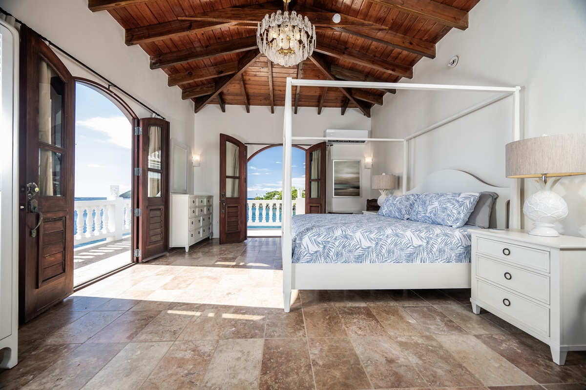 Pool Bedroom 1: Take in the expansive ocean views from your plush four-poster bed.