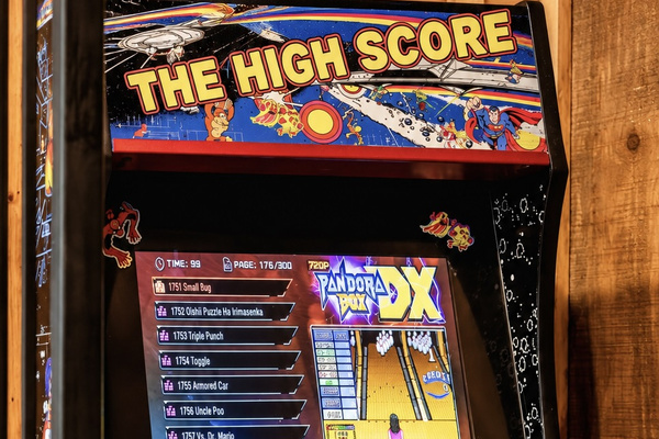 Flip through thousands of retro titles on the two-player upright cabinet.