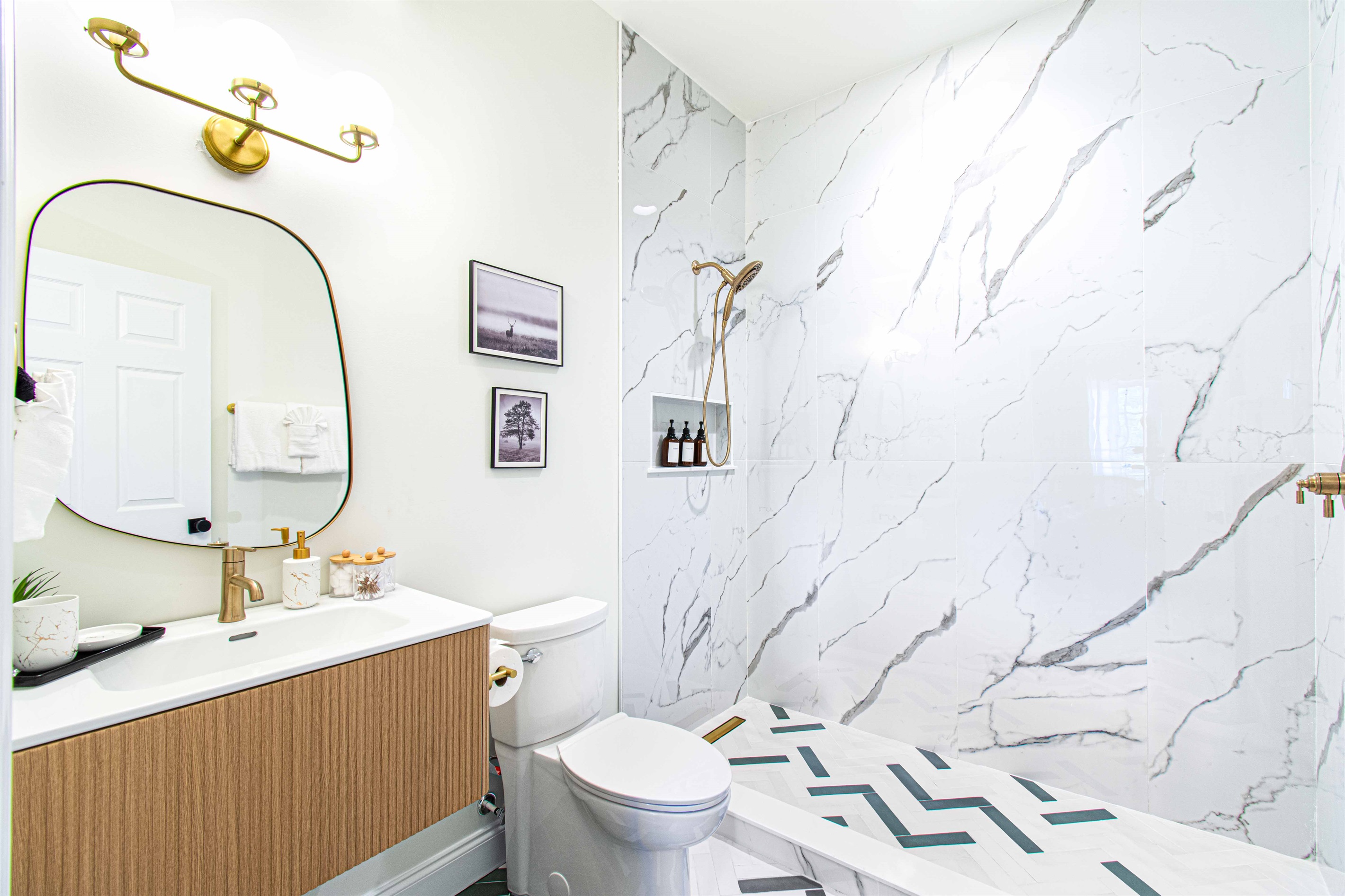 Welcome to your private oasis! This brand new ensuite bathroom features exquisite green and white mosaic tiles, a sleek standing shower, and elegant gold trim. Every detail is designed for luxury and comfort—your perfect retreat awaits!