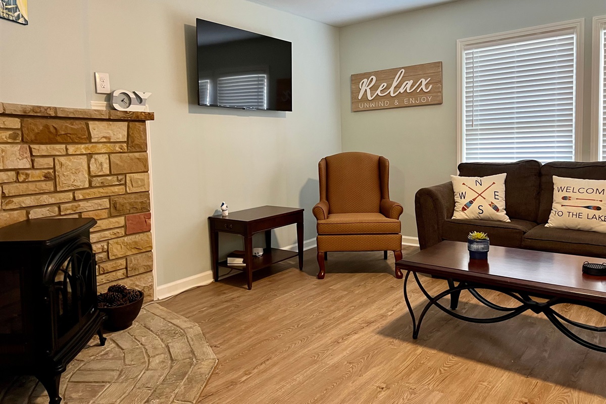 Smart TV and electric fireplace in living area