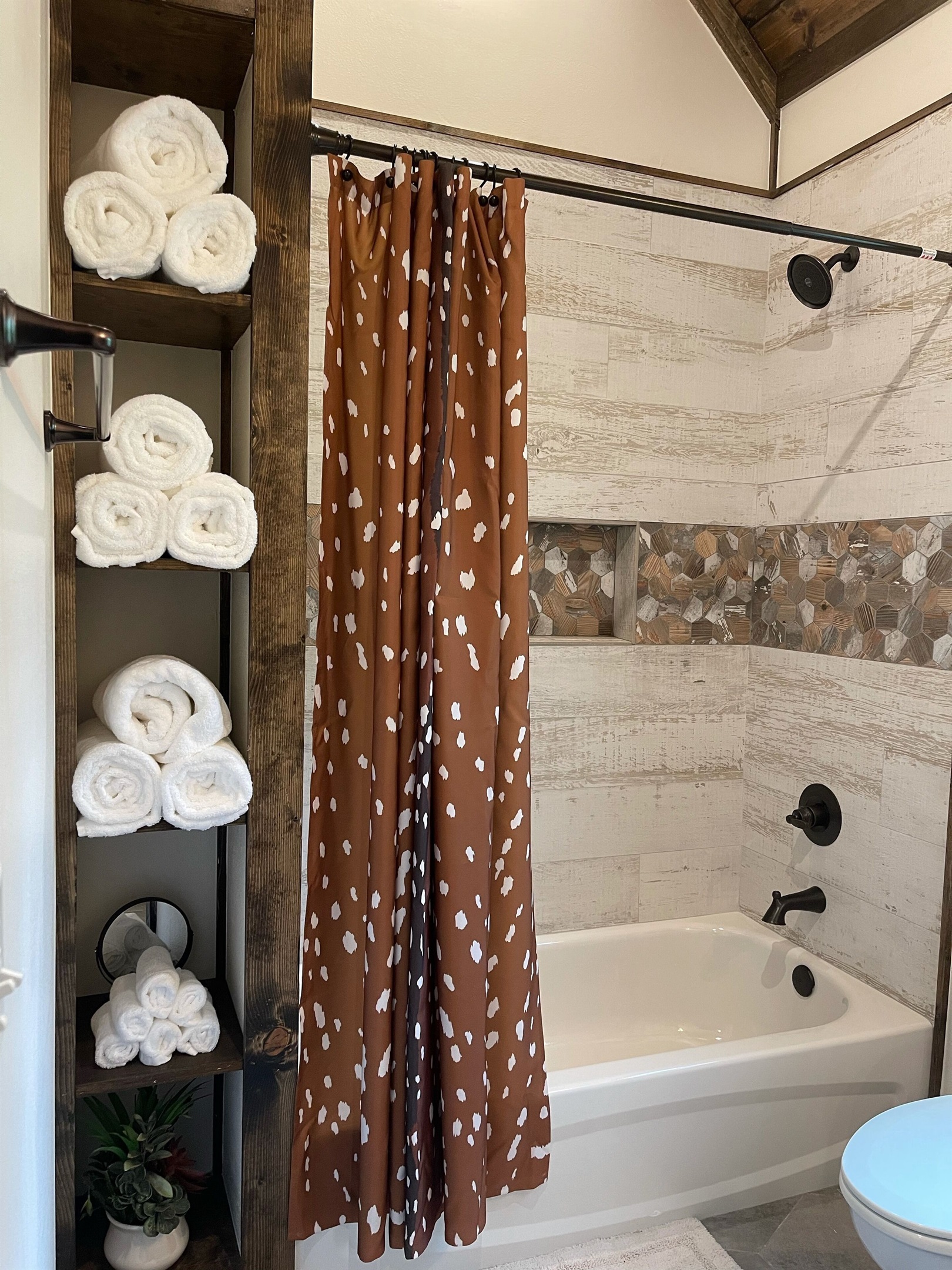 Full bathroom off the upstairs loft with plenty of storage space for all.
