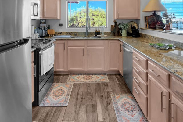 Complete kitchen with granite countertops and open view