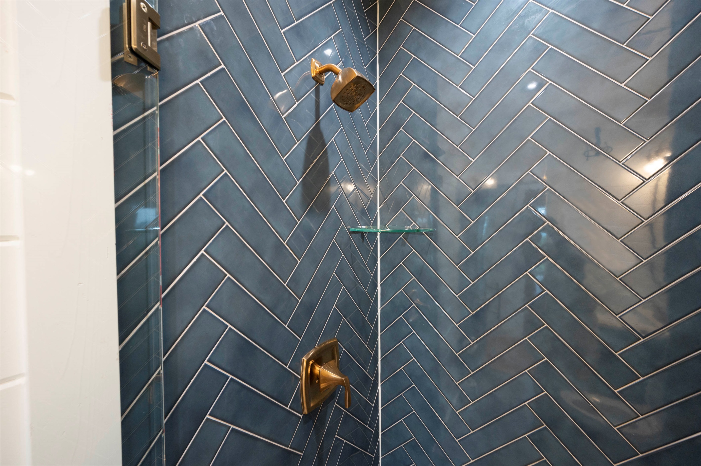 Sleek walk-in shower with elegant tilework and spa-like ambiance