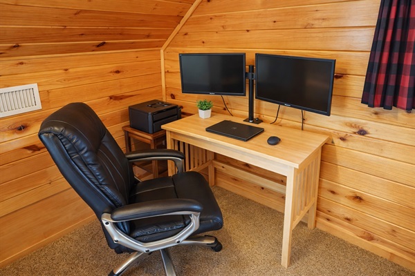 Dedicated workspace with dual monitors — ideal for remote work with lake views.