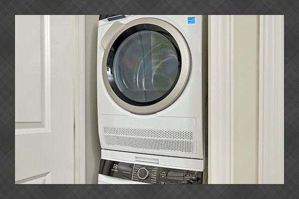 A brand-new Electrolux washer and dryer are conveniently located in the half bath.