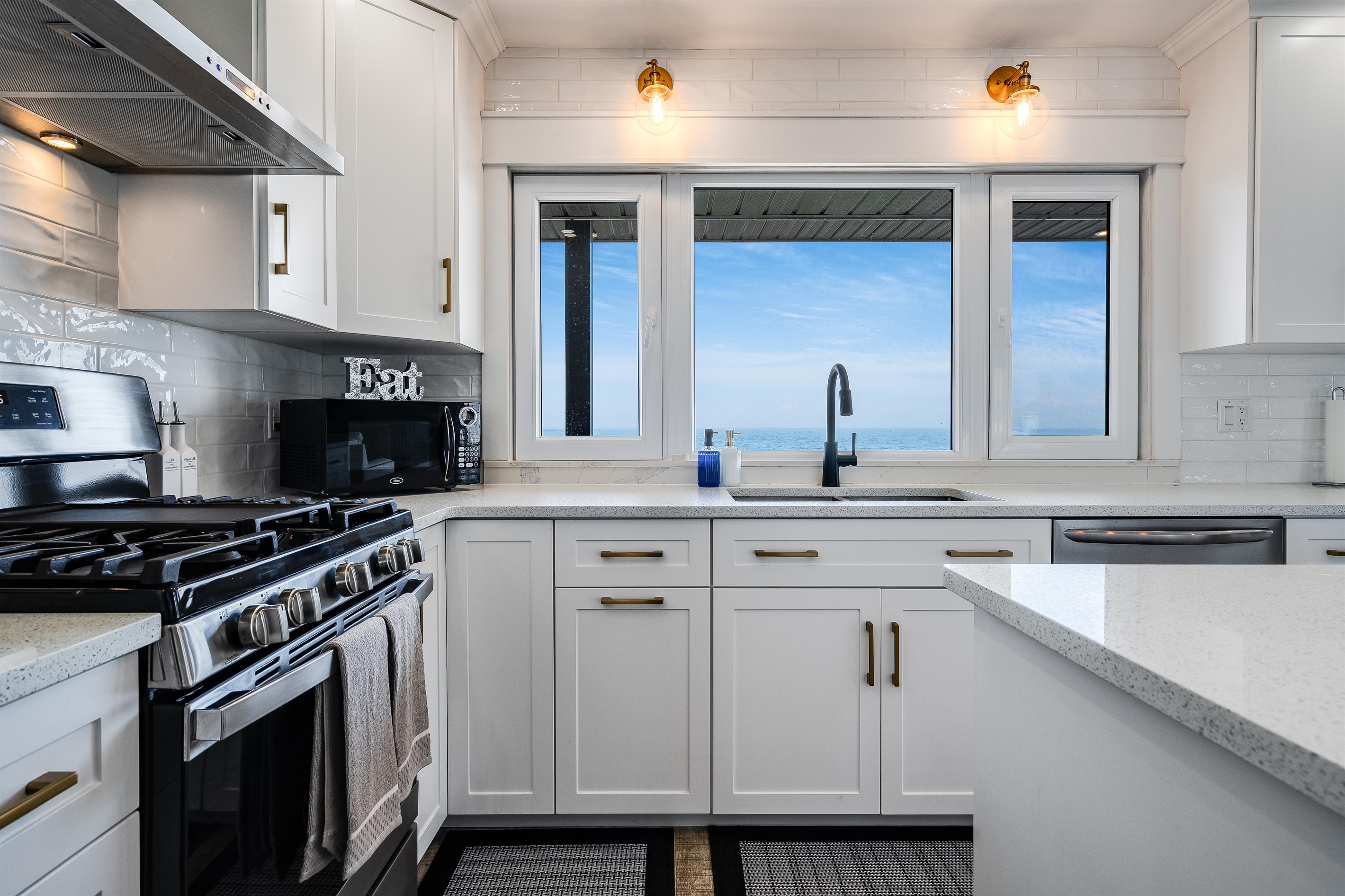 Matte black fixtures and stainless steel appliances