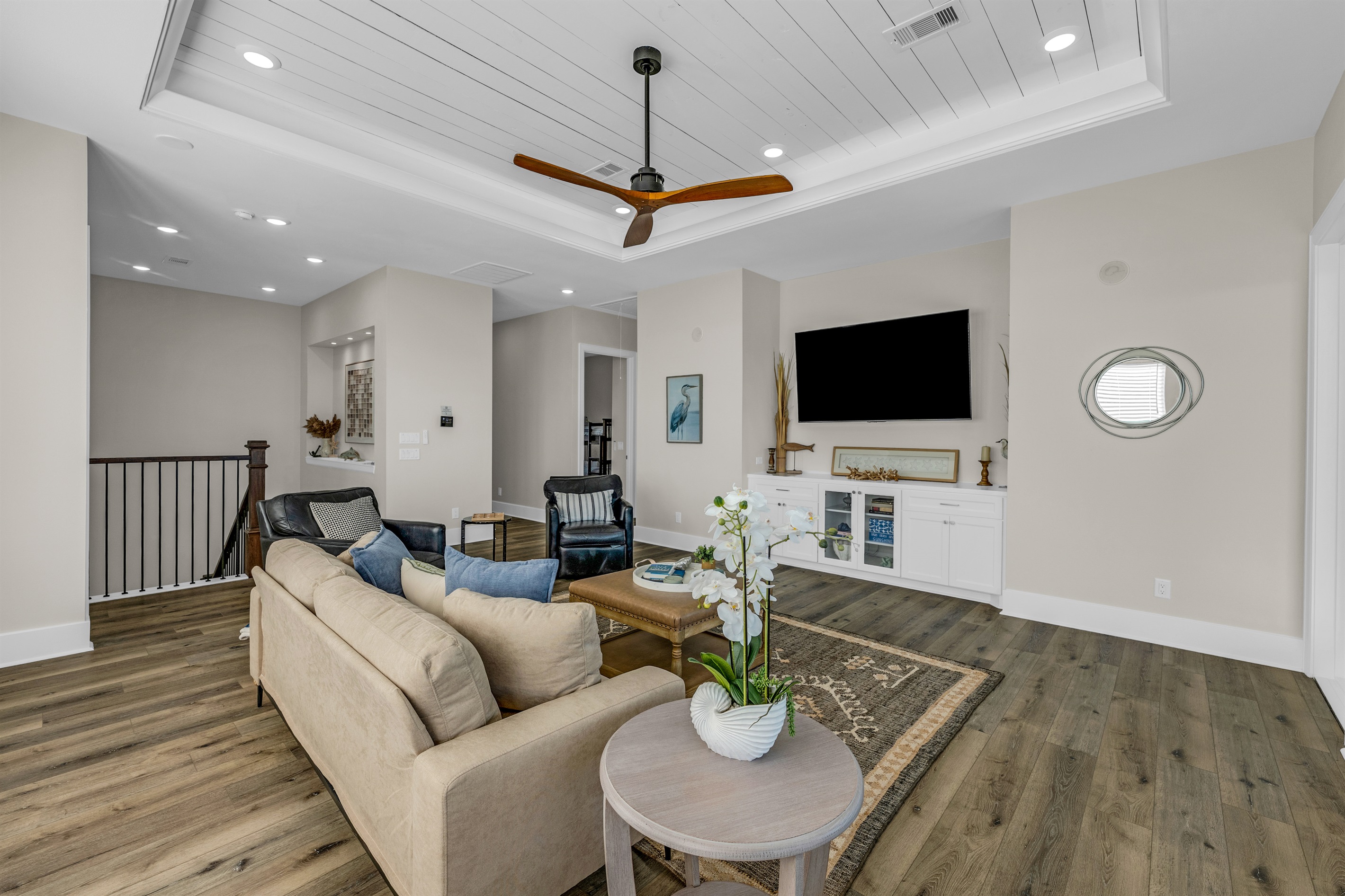 Costa Cristal Media Room: Step into a spacious, well-lit media room where natural light fills the space and a smart TV offers modern entertainment. 