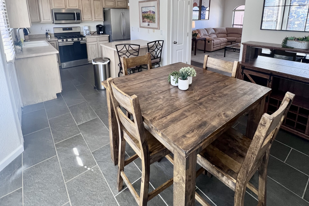 The spacious kitchen boasts ample counter space, stainless steel appliances, and all the essentials you need to whip up a gourmet meal with ease.