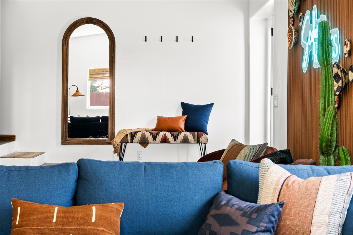 Enter into a bright and cozy living space with Southwestern modern decor, perfect for unwinding.