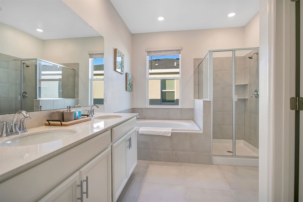 Master bathroom featuring independent tub and shower.