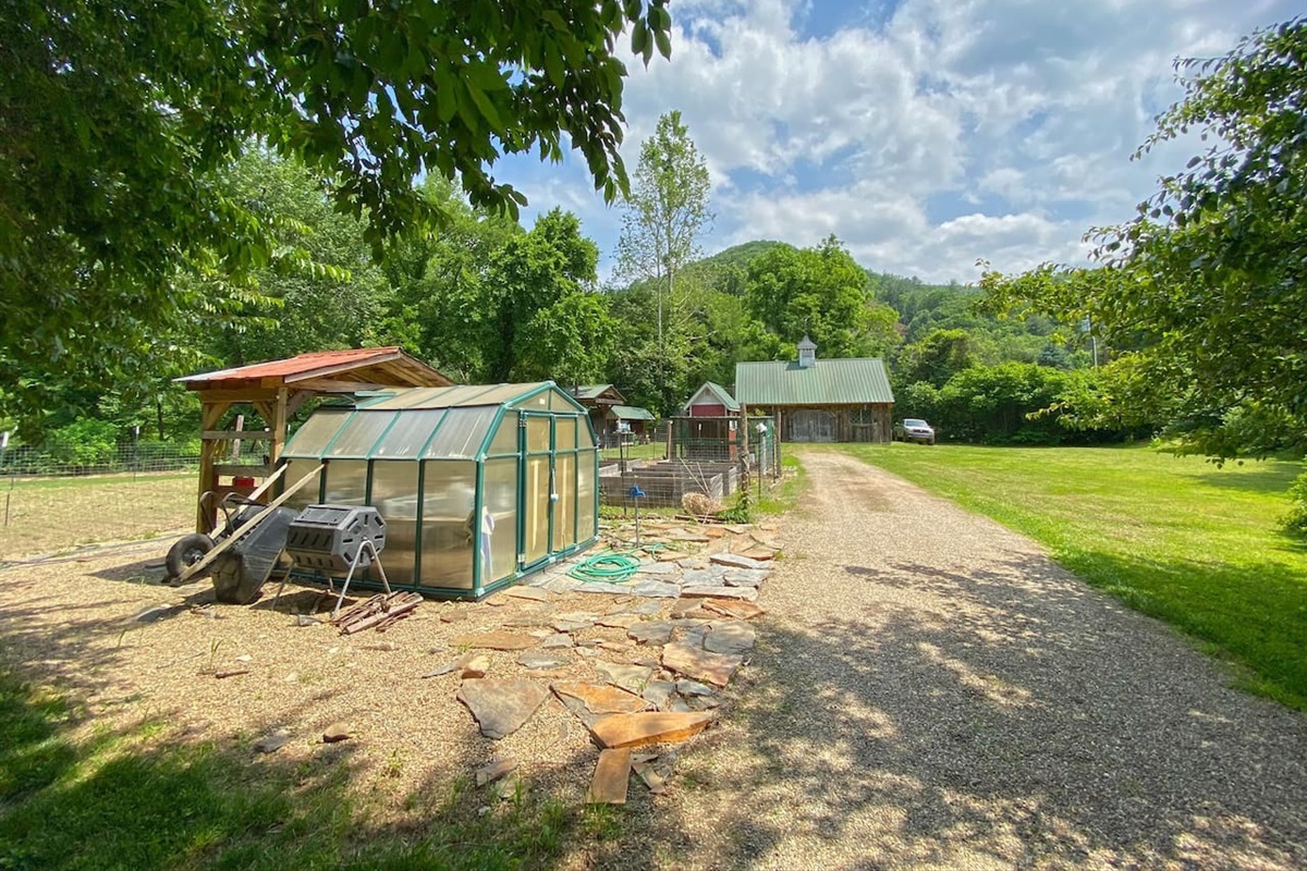 Raised bed garden and barn on the property