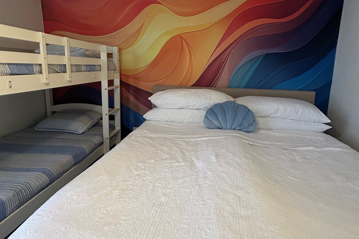 Second bedroom with a King bed and a twin over twin  bunkbed on second floor