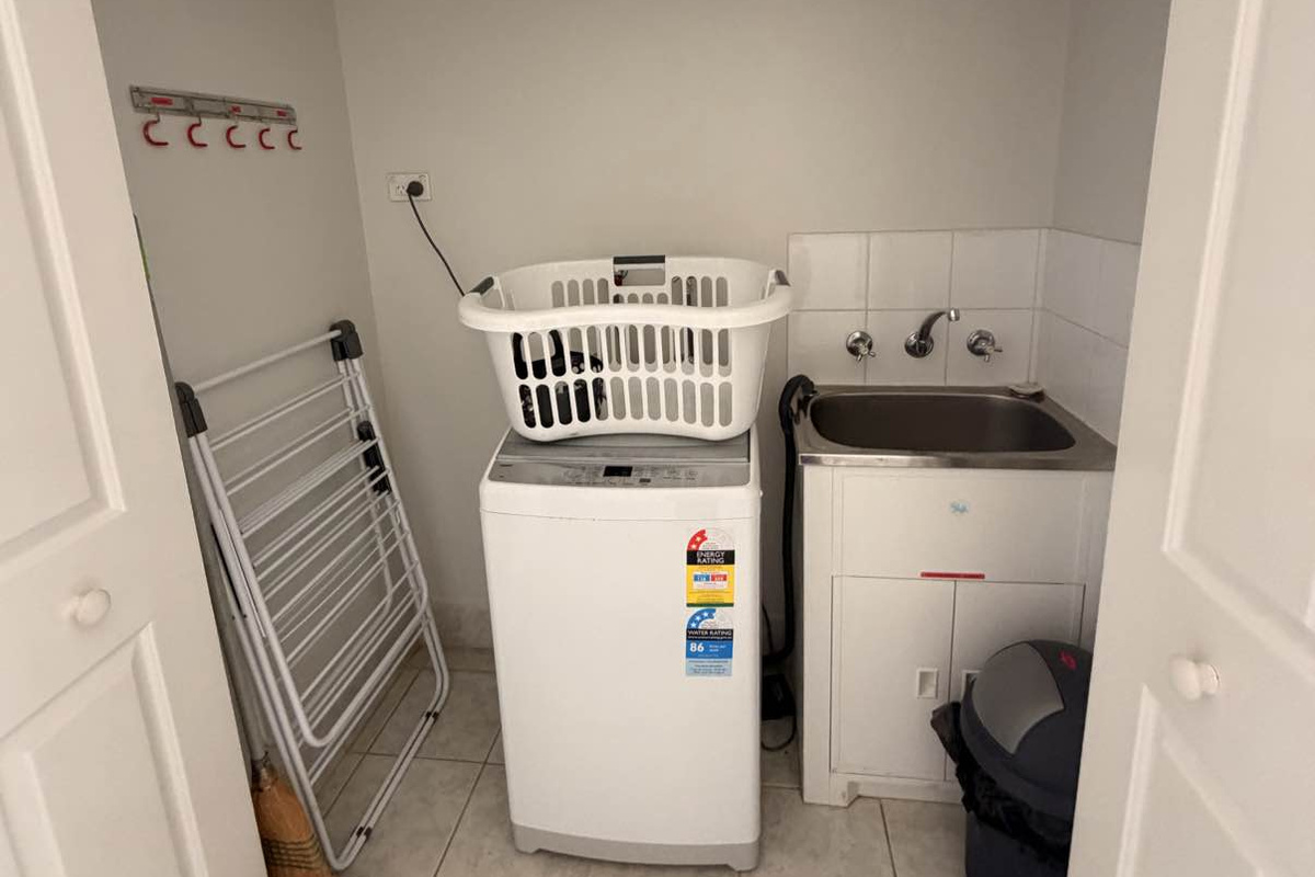 European style laundry with Top Load washing machine
