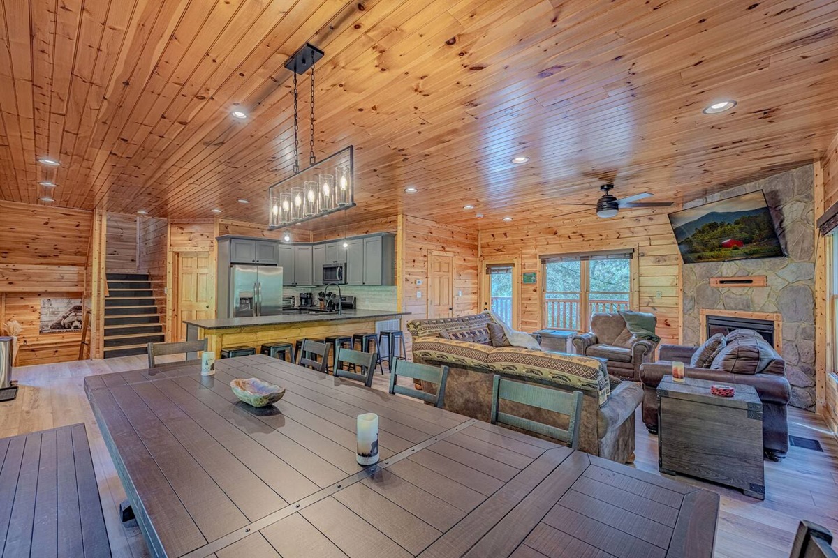 Open-concept dining area seats the whole group. Luxury Gatlinburg cabin for 12 &mdash; families, reunions, and tournament teams welcome. The Crown Jewel.