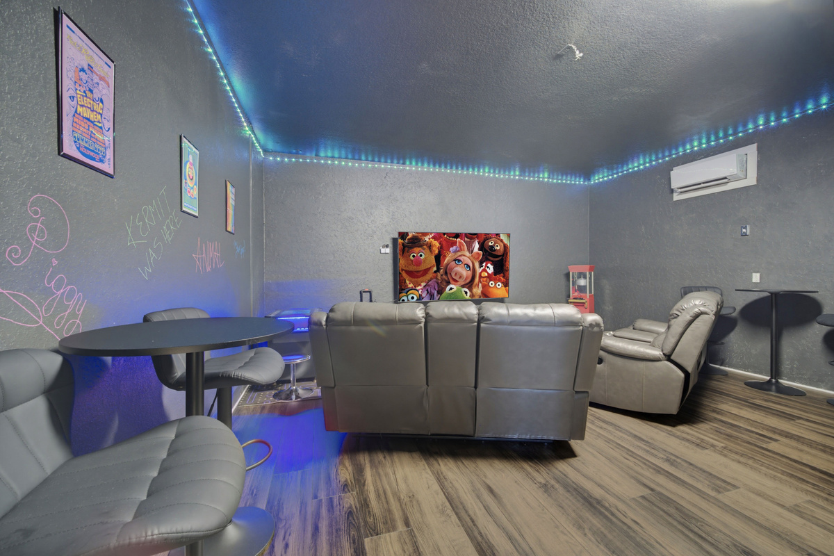 Fully air conditioned game room w/ karaoke stage, 85" TV, and plenty of seating