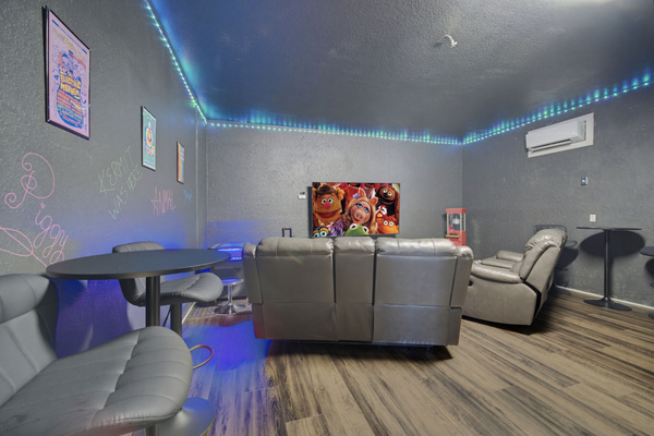 Fully air conditioned game room w/ karaoke stage, 85" TV, and plenty of seating
