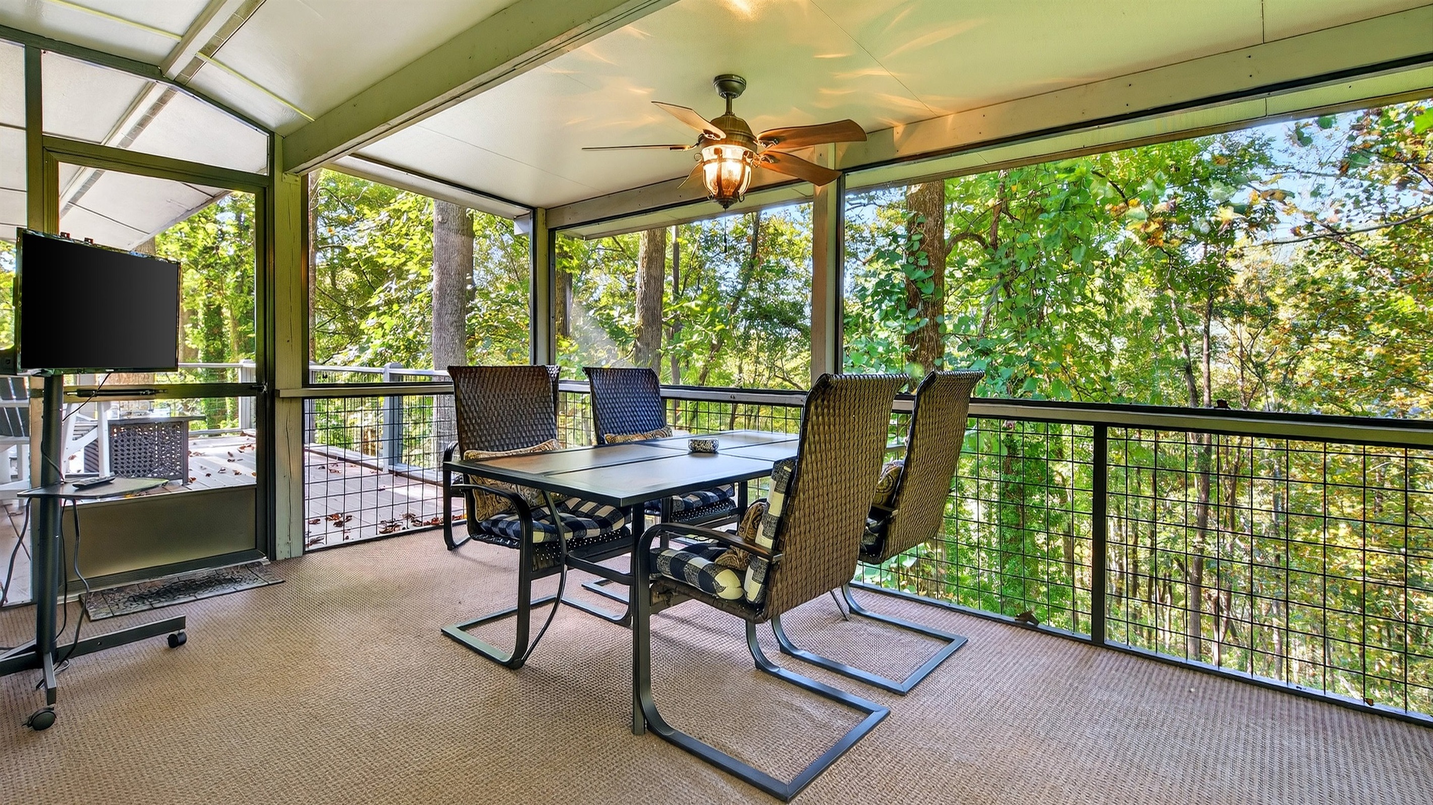 Outdoor dining, seating for 4 on the upper-level screened in porch..