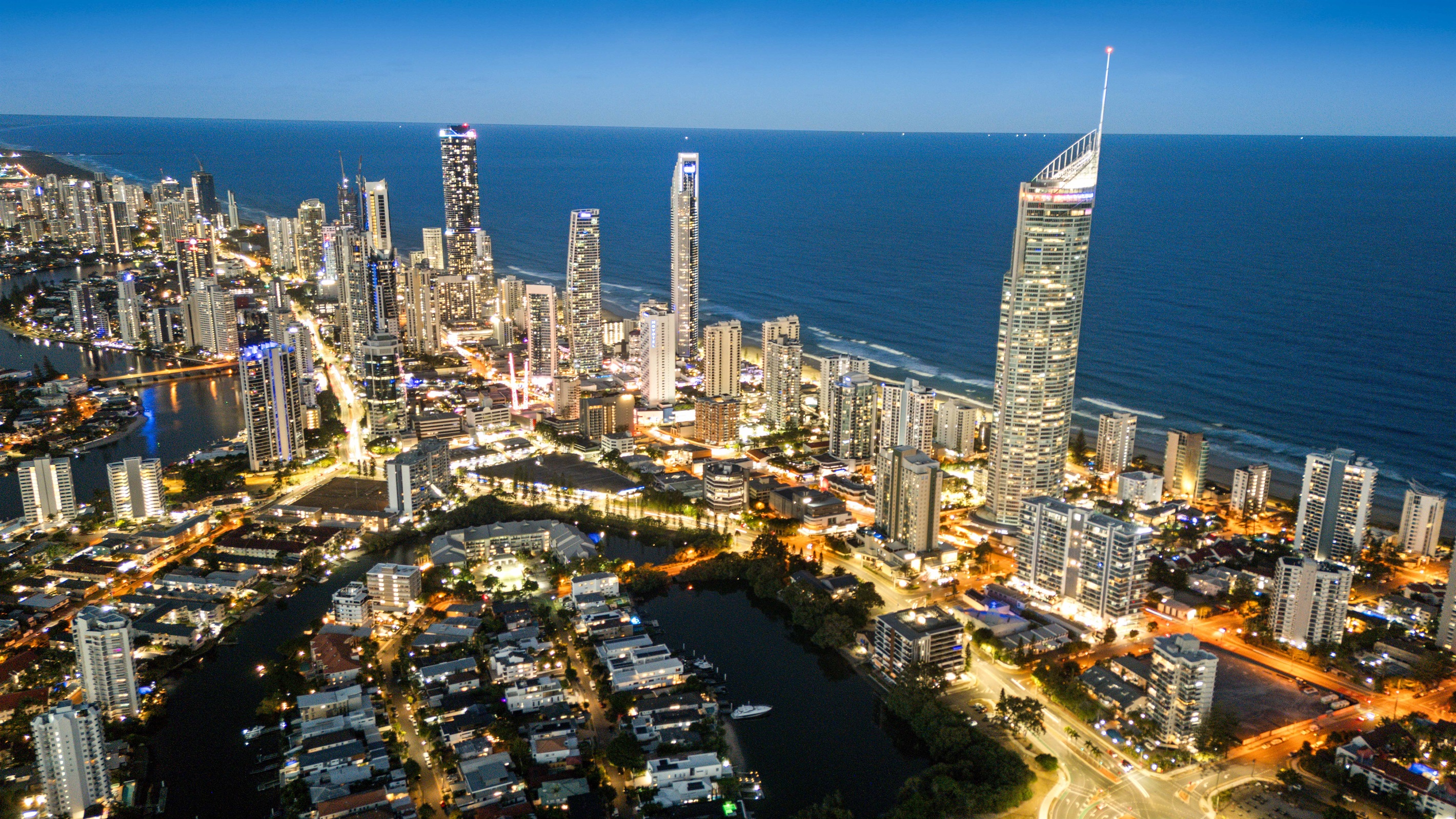 Experience the energy of Surfers Paradise by night, just minutes from your private waterfront retreat.