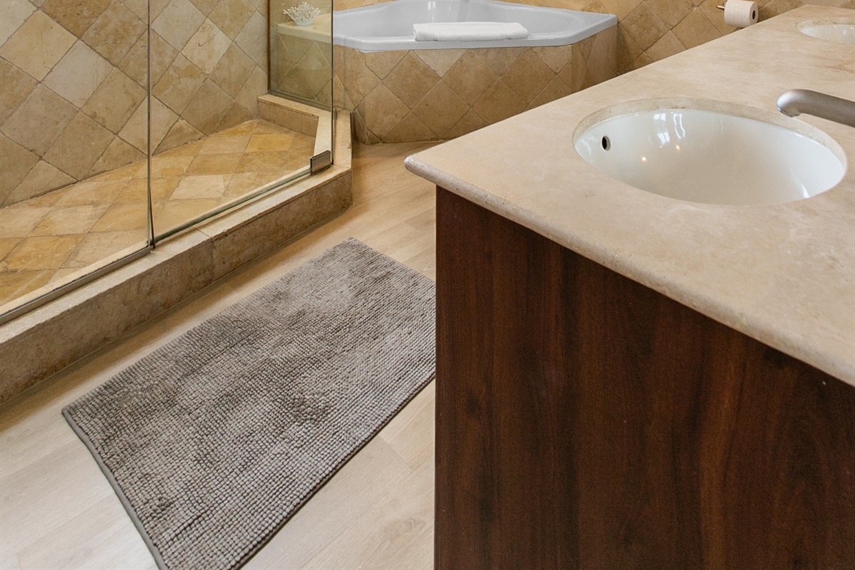 Primary Suite en-suite with separate tub and walk-in shower, double-sink vanity