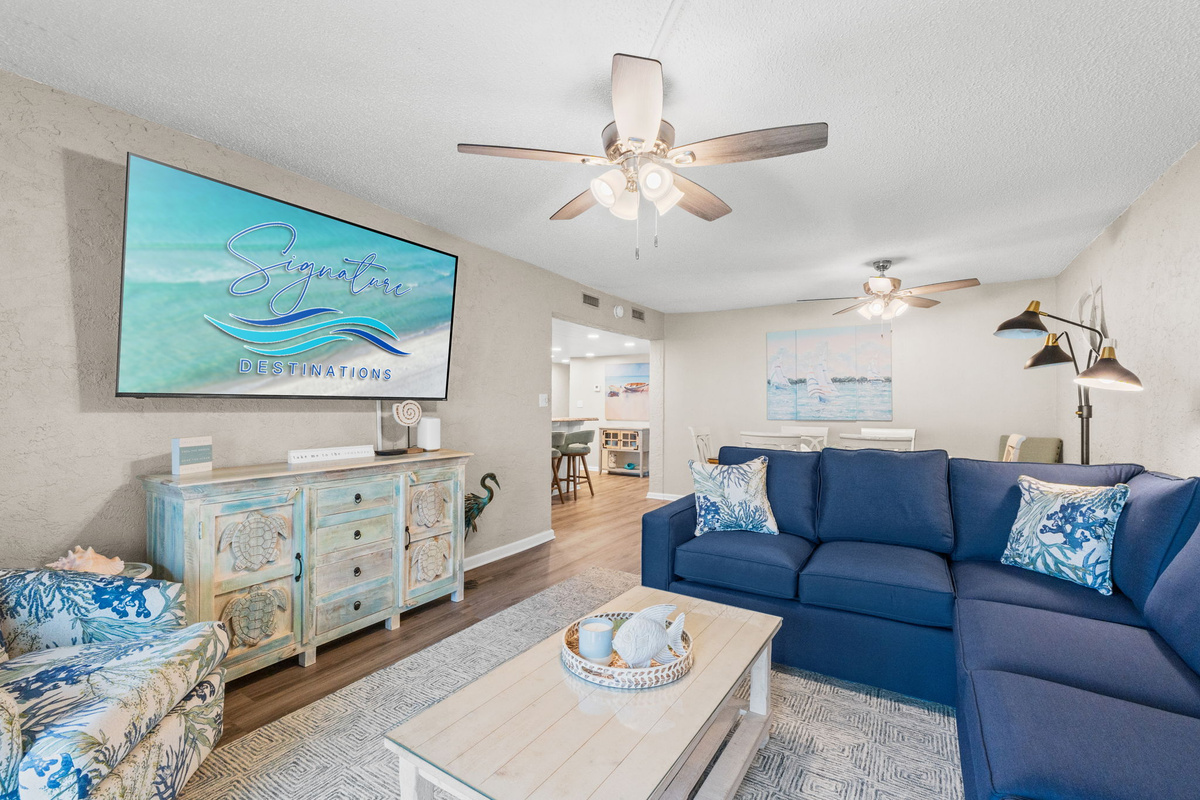 Living Room with Queen Sized Sleeper Sofa and Balcony Access