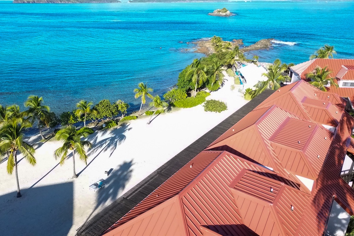 Drone shot of Sapphire&rsquo;s pristine coastline and red rooftops.