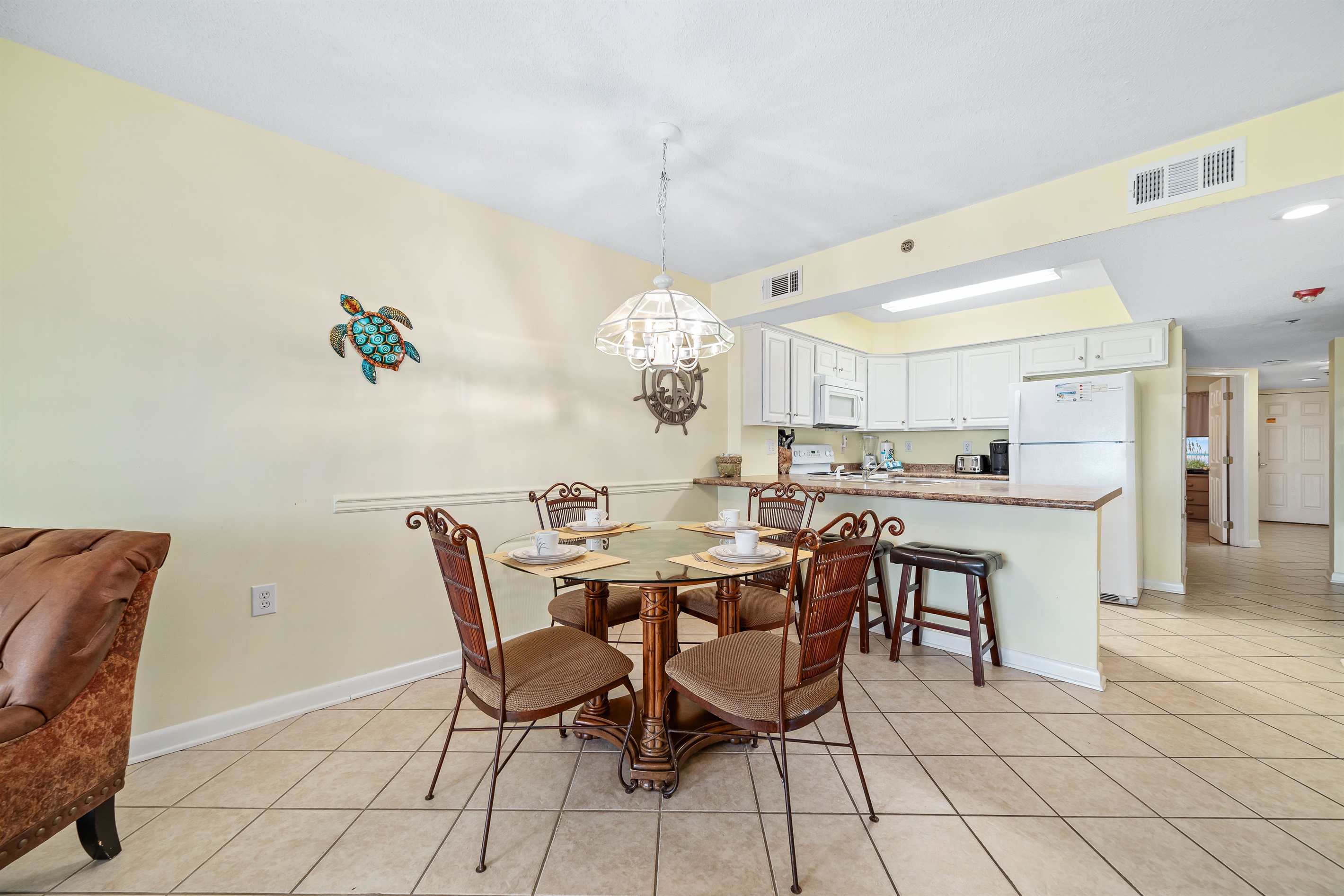 Gather, eat, and make memories. Our spacious dining area and adjacent breakfast bar provide plenty of room for guests to enjoy meals and conversations, creating the perfect setting for your vacation.