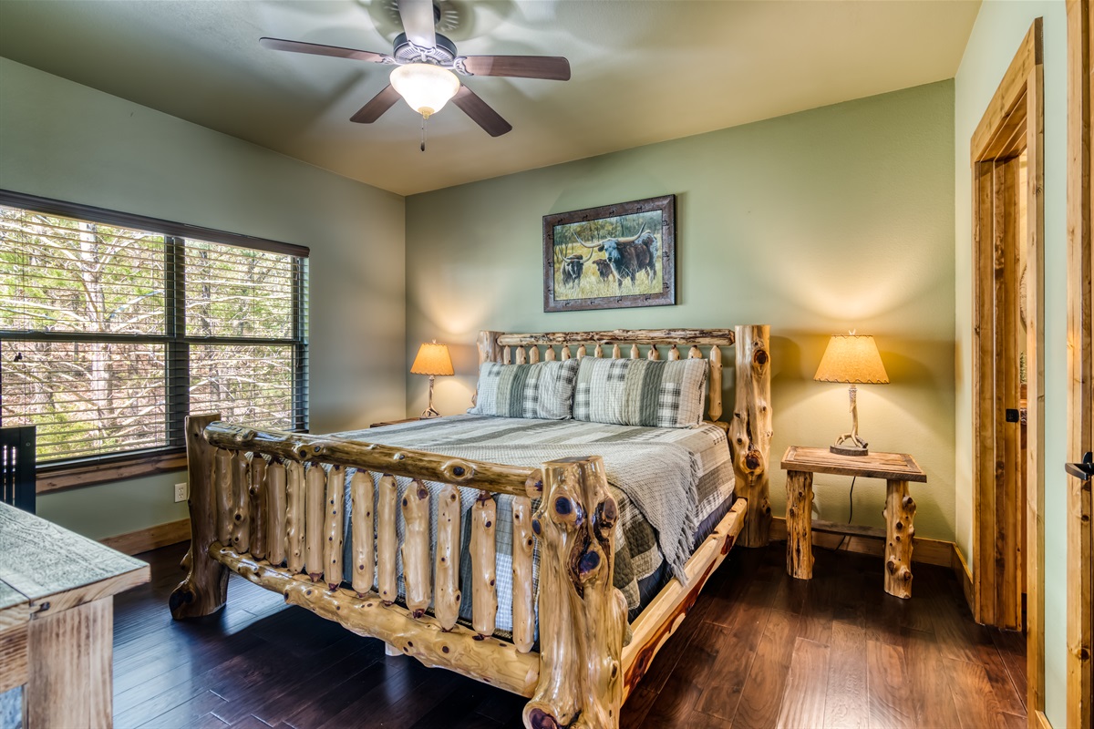 Main level King room with a TV, attached bathroom, and crib!