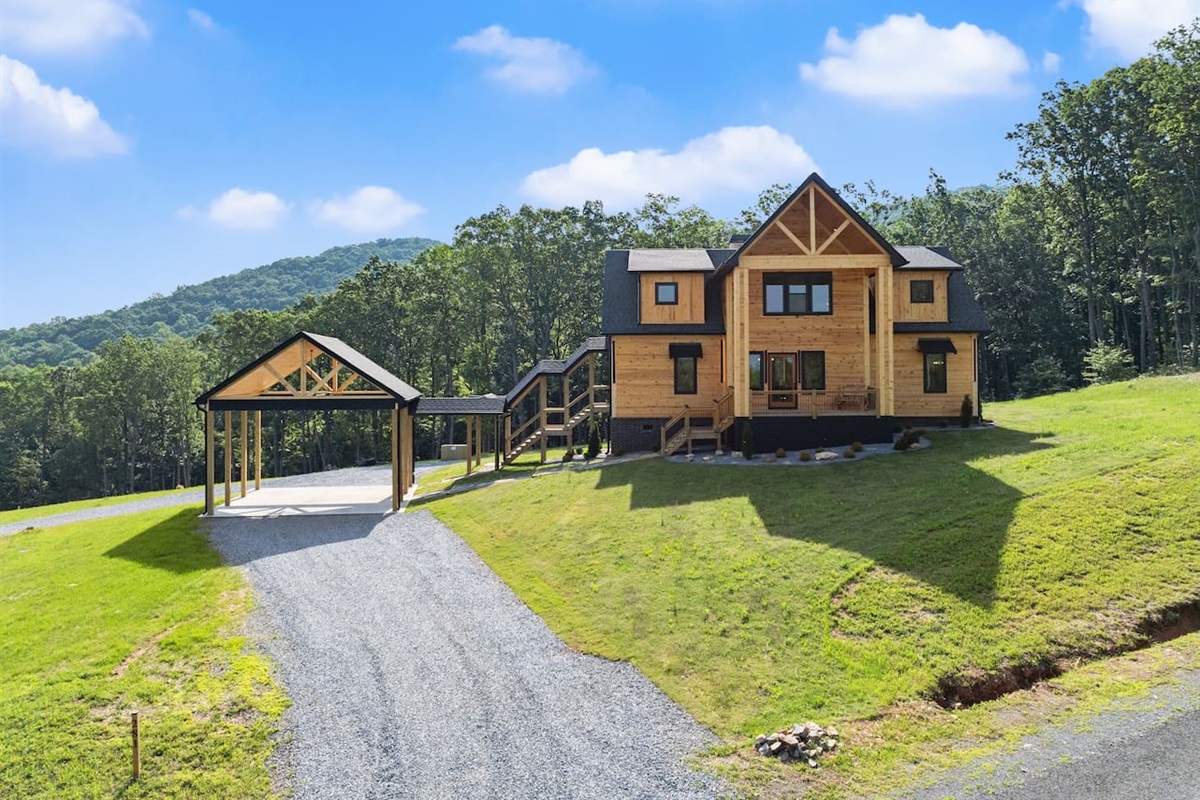 Welcome to your luxury mountaintop getaway featuring a custom-built cabin and spacious covered parking.