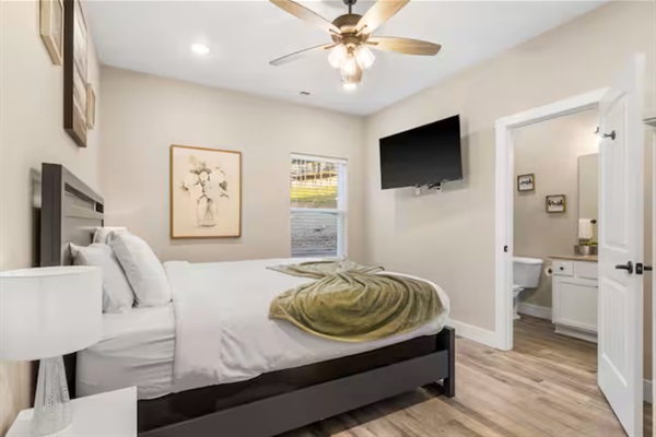 Bedroom #3 has a king size bed, TV, dresser and closet.