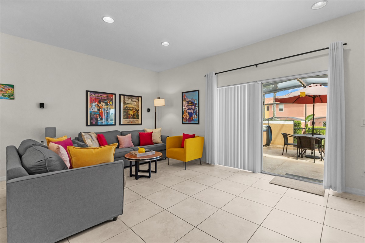 Living room opens directly to screened patio with spa and outdoor seating