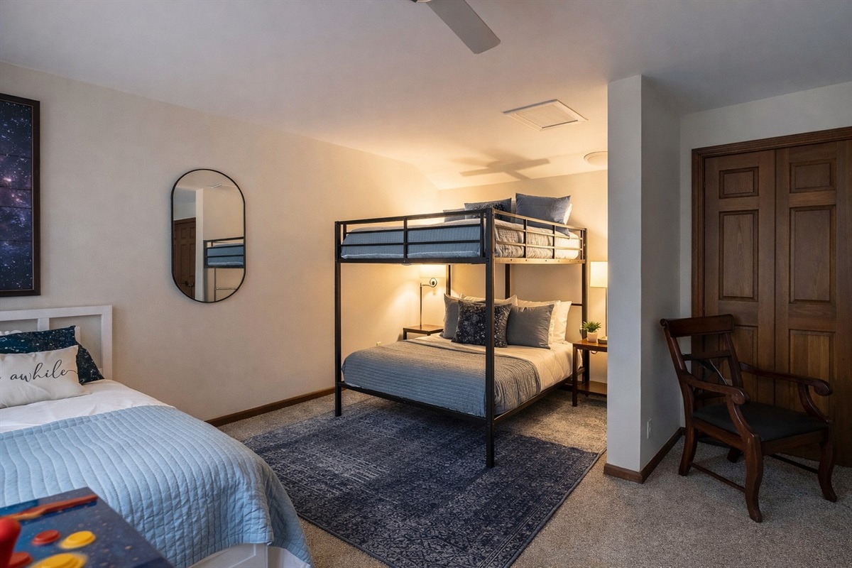 Spacious queen-over-queen bunk beds offer both comfort and fun in the ultimate kid (or teen!) hangout zone.