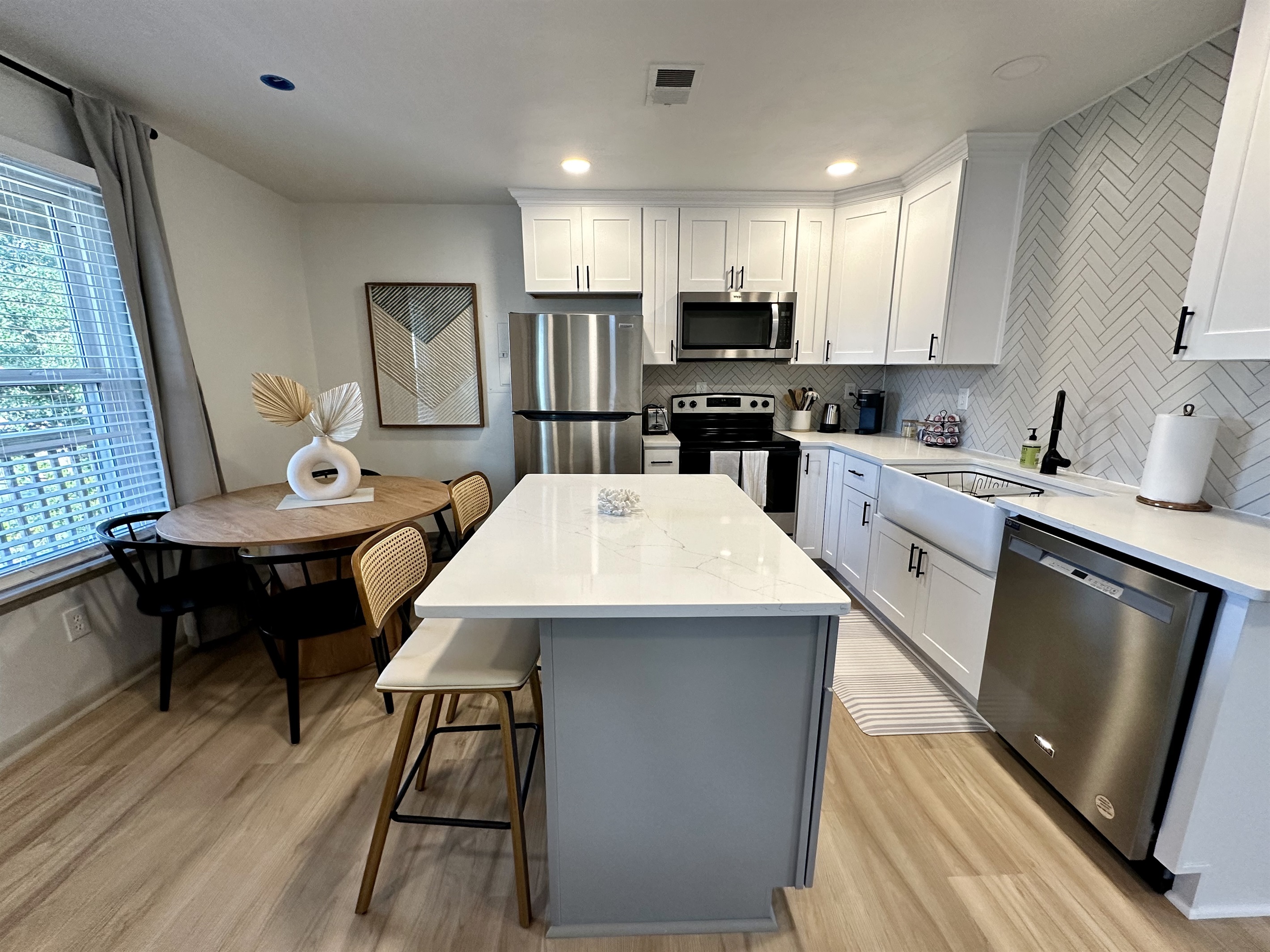 kitchen island and seating for 4 at the dining table.
