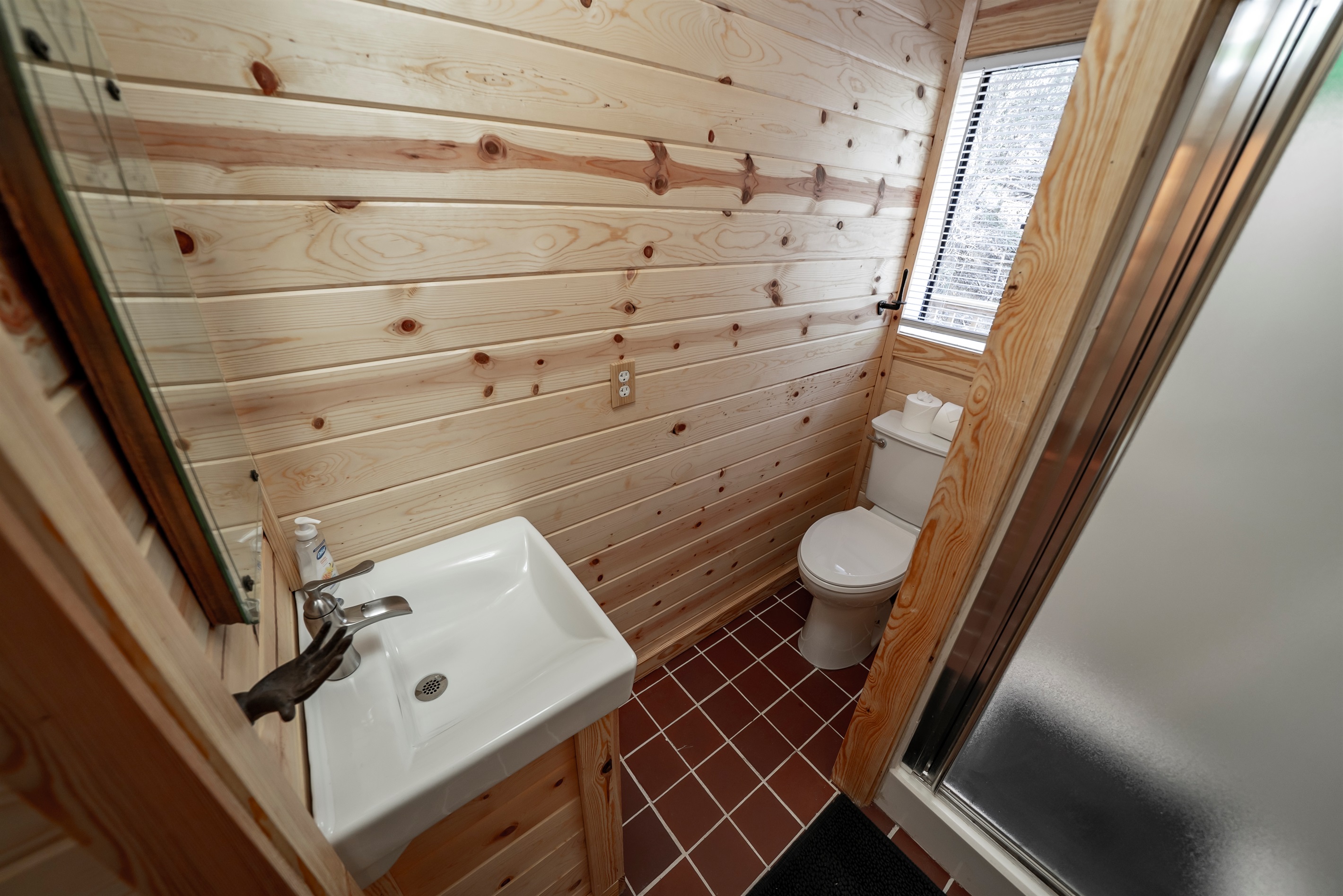 Fresh and functional with a rainfall shower, ample storage, and a washer and dryer for added convenience during your stay.