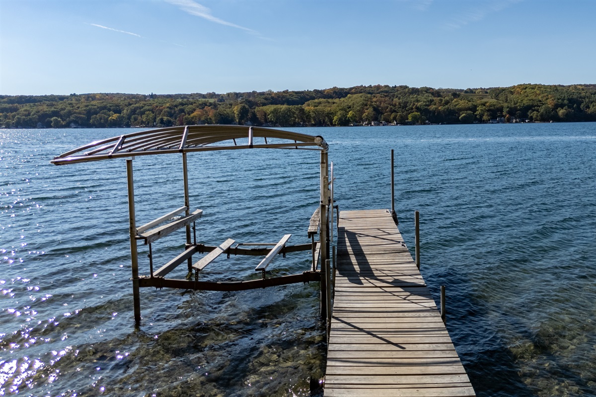 Private dock stretching into Keuka Lake inviting you to jump in or relax.