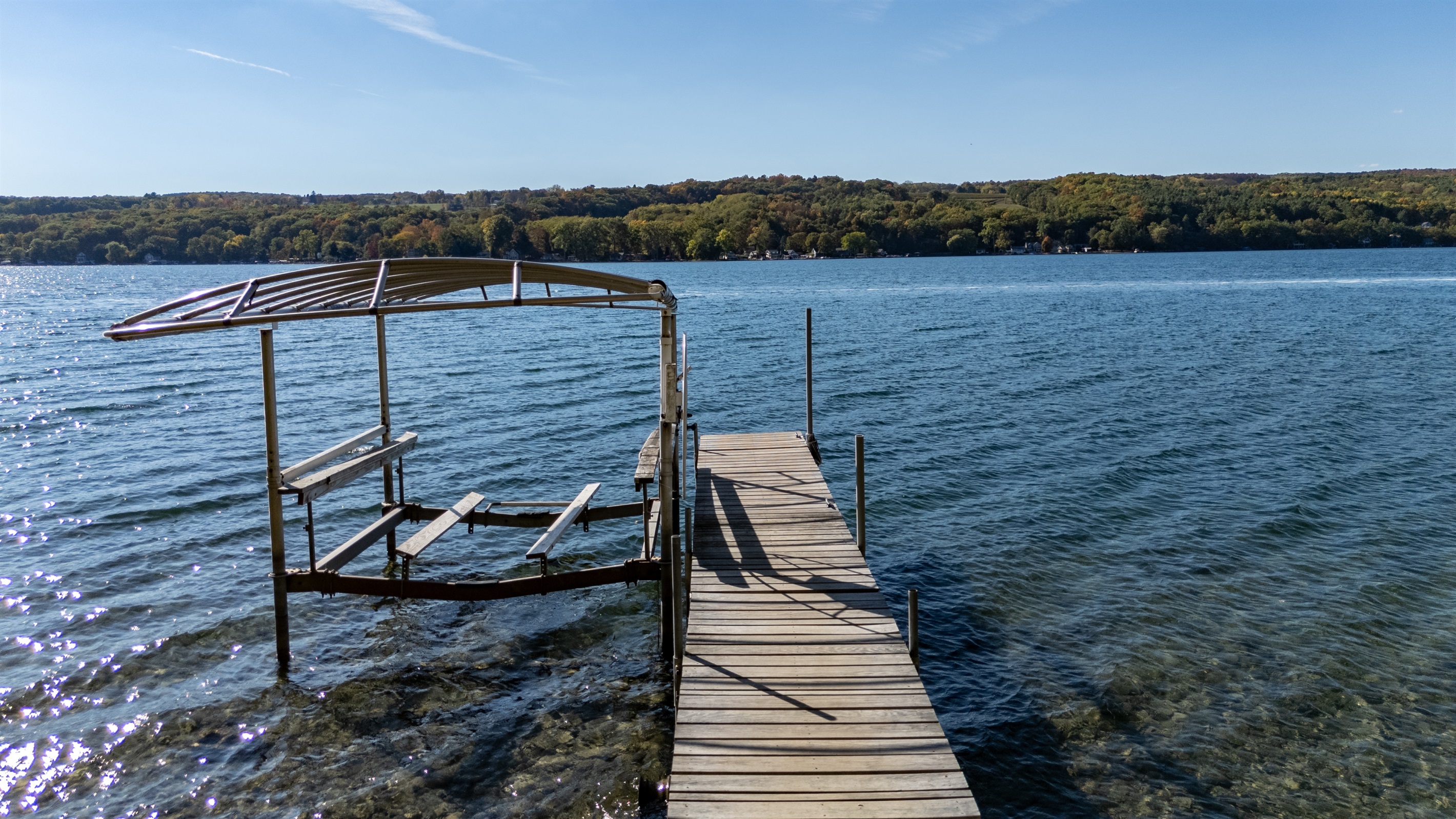 Private dock stretching into Keuka Lake inviting you to jump in or relax.
