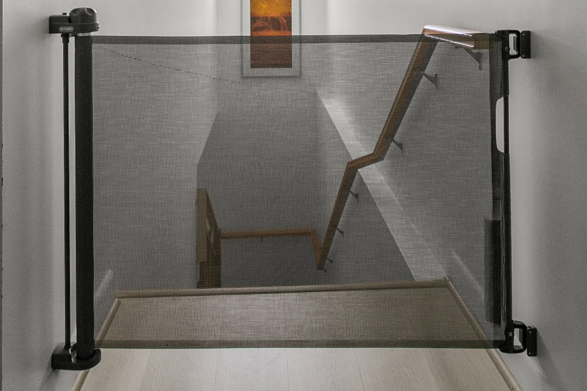 Retractable safety gate at stair landing