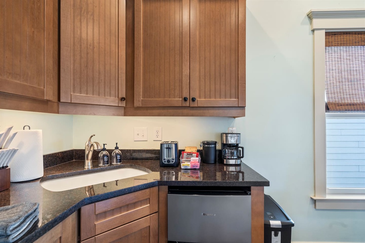 Drip coffee maker and Keurig both provided — your mornings are covered