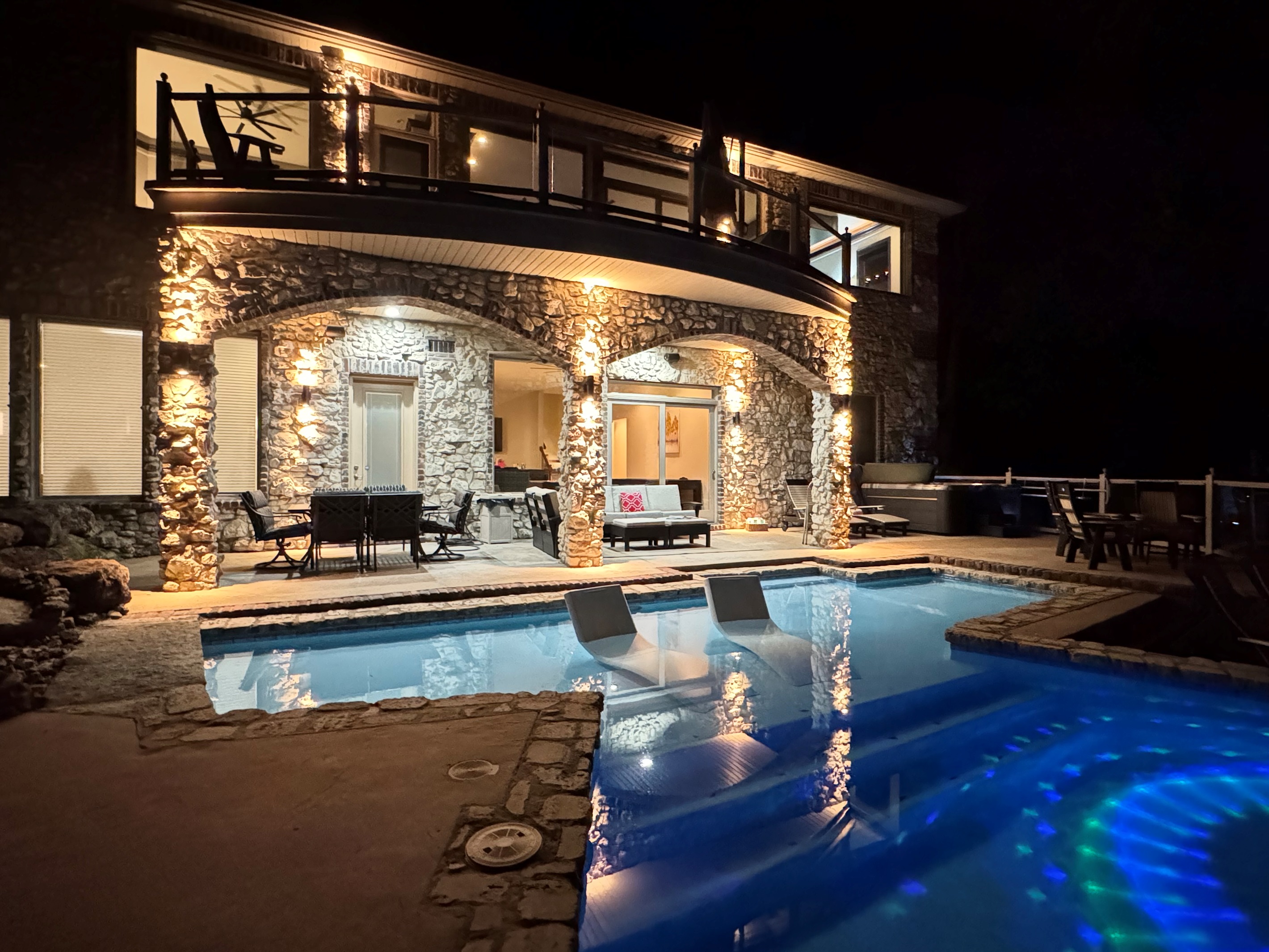 Plenty of outdoor lighting to enjoy the pool on a summer's evening.