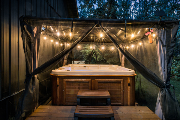 End the day with a private soak in the hot tub, tucked under a covered gazebo and surrounded by the quiet forest.