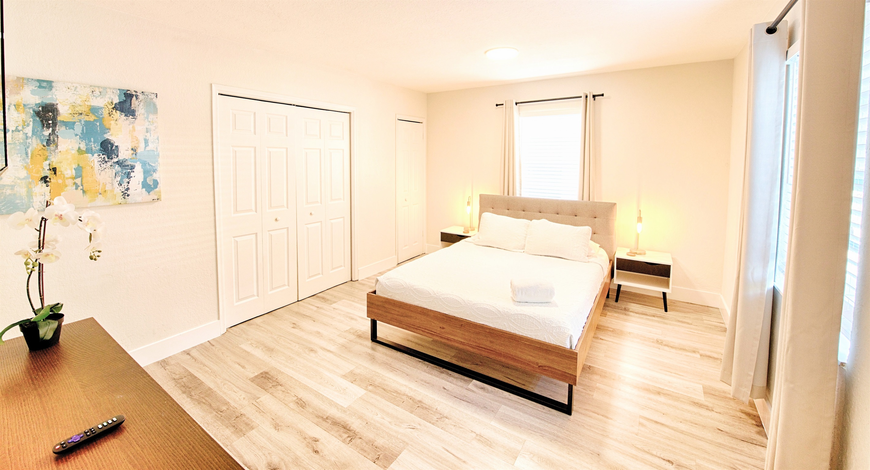 Primary bedroom with view of closets