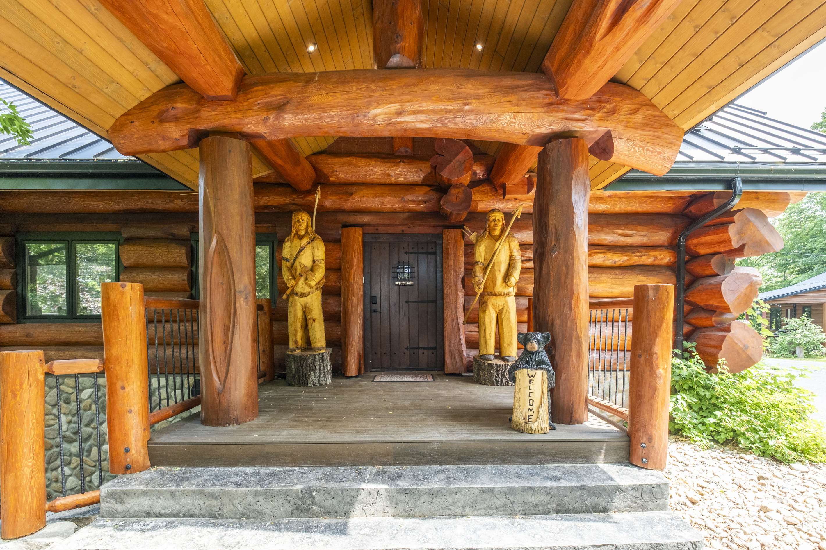 Handcrafted covered entrance to Bear Lodge