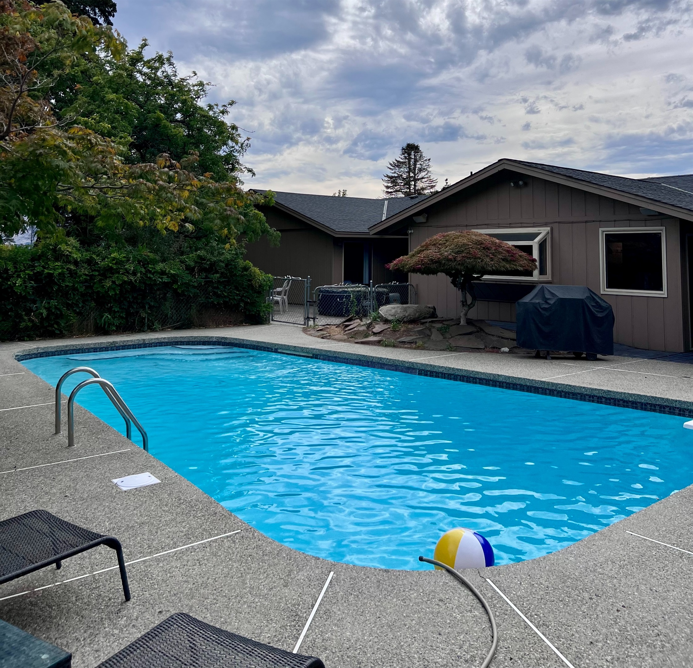 Enjoy the large in-ground swimming pool in the private back yard.