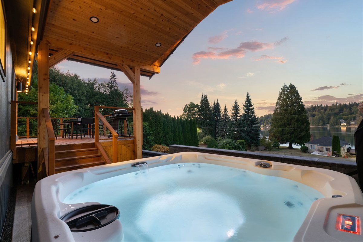 Enjoy relaxing hot tub views overlooking peaceful Hammersley Inlet and the spacious deck—pure tranquility