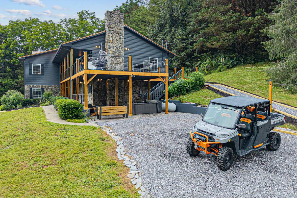 Modern mountain home with stunning views and outdoor seating for ultimate relaxation!