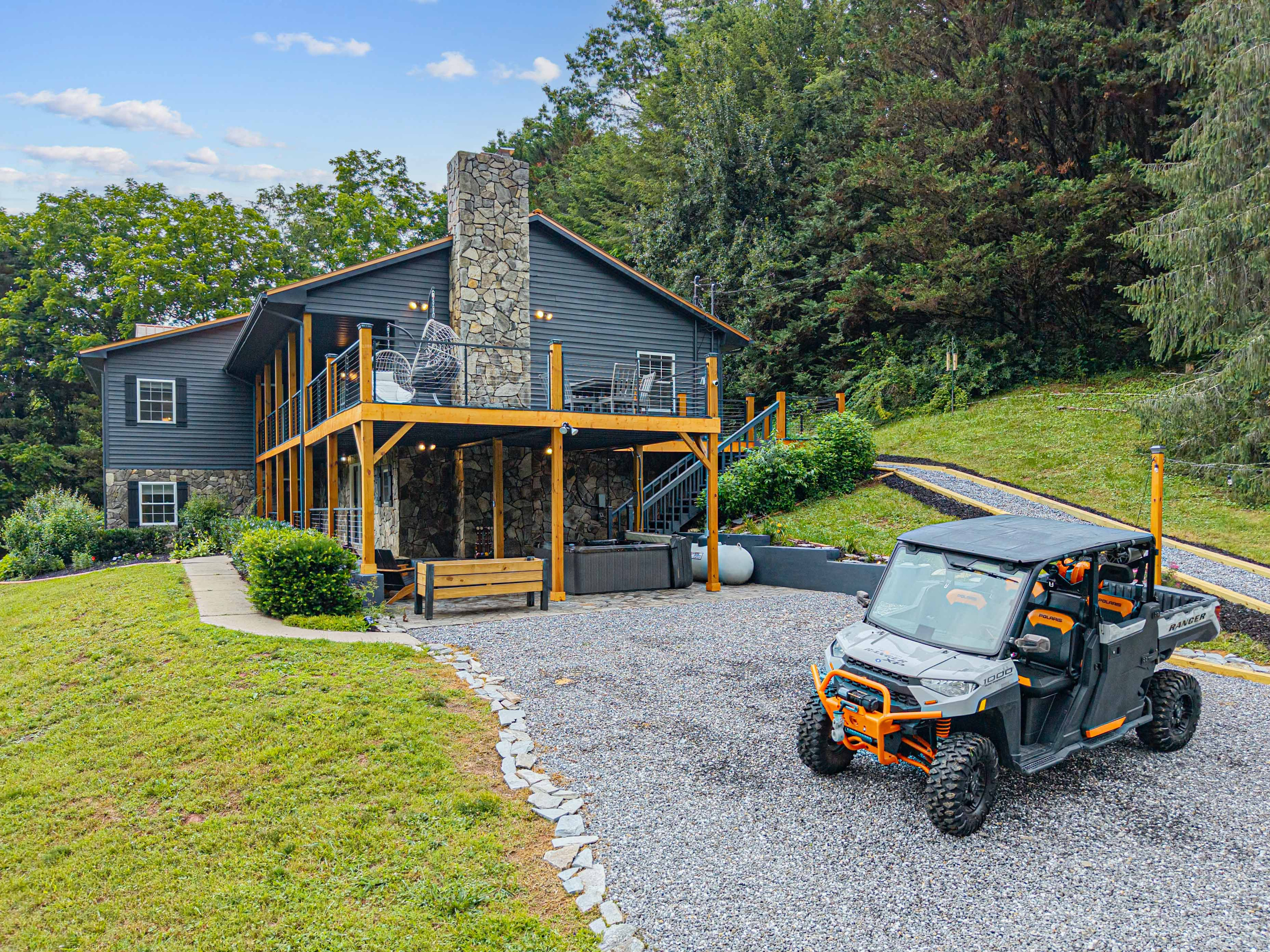 Modern mountain home with stunning views and outdoor seating for ultimate relaxation!