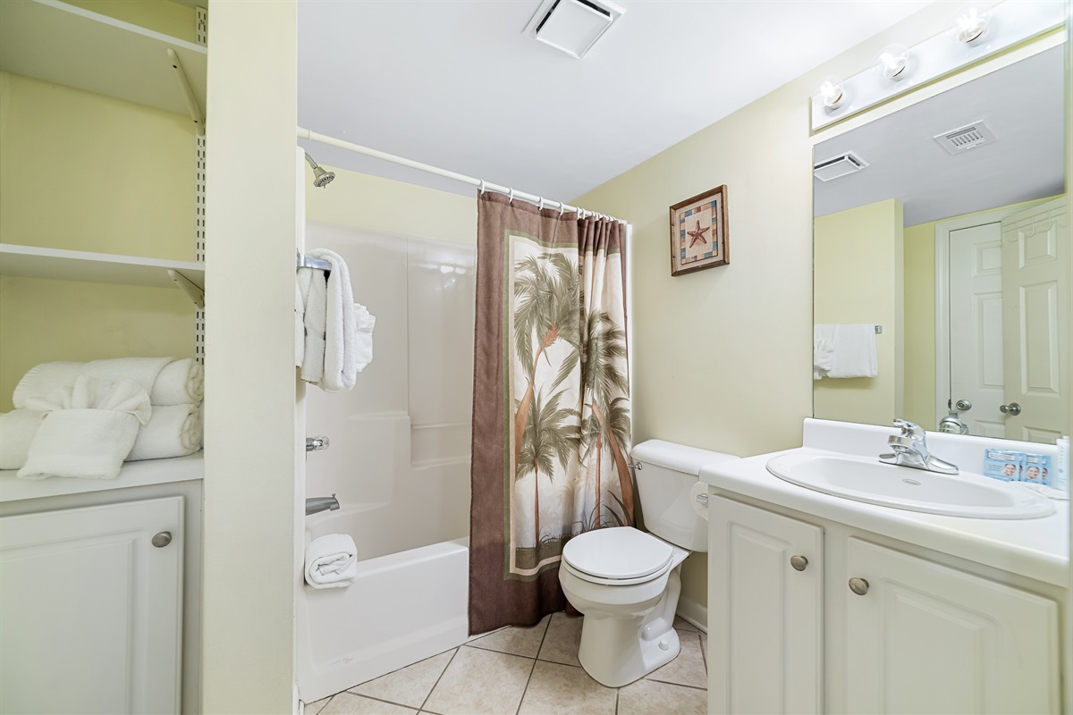 Freshly updated bathroom featuring a shower/tub combination, ample vanity space, and modern fixtures.